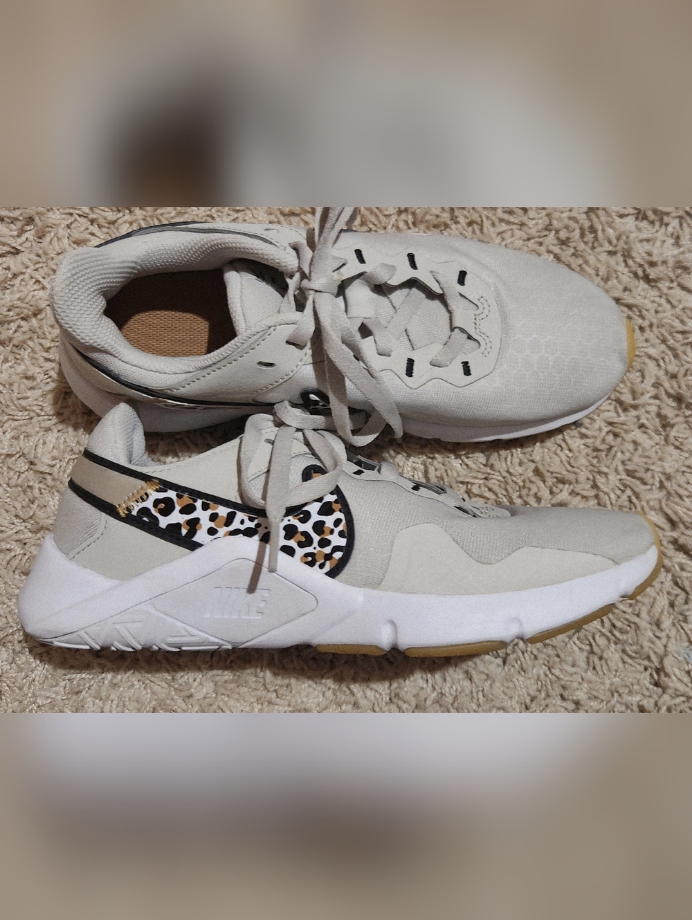 Nike Beige and White Sneakers with Leopard Swoosh Accent